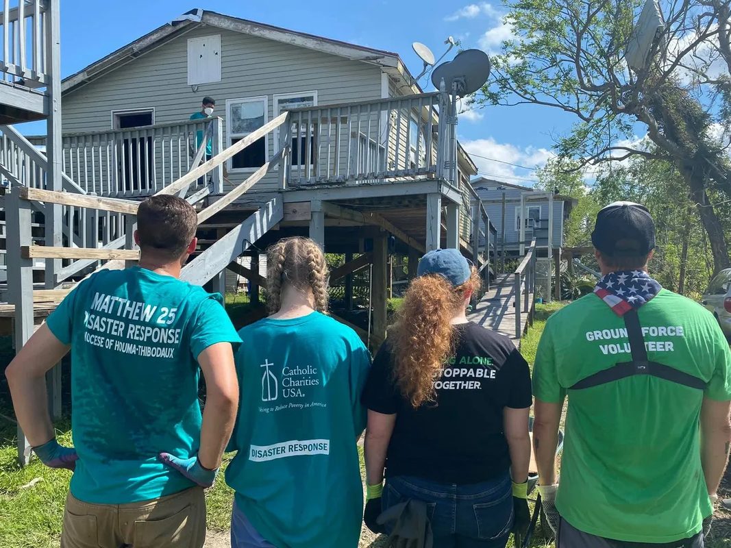 Ground Force volunteers at damaged home